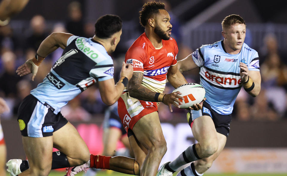 Hamiso Tabuai-Fidow in action for the Dolphins against the Sharks. Image: Getty