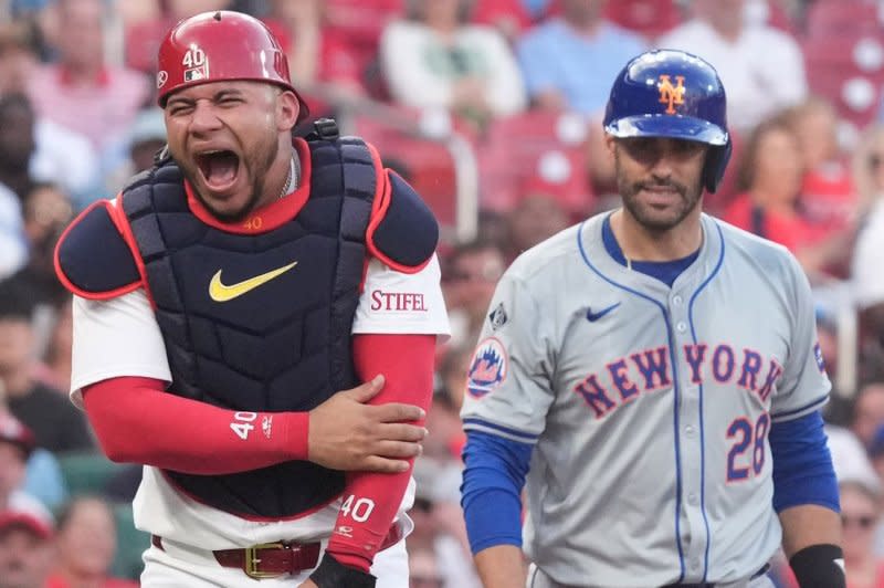 St. Louis Cardinals catcher Willson Contreras yells in pain after being hit by a bat by New York Mets slugger J.D. Martinez in the second inning Tuesday at Busch Stadium in St. Louis. Photo by Bill Greenblatt/UPI