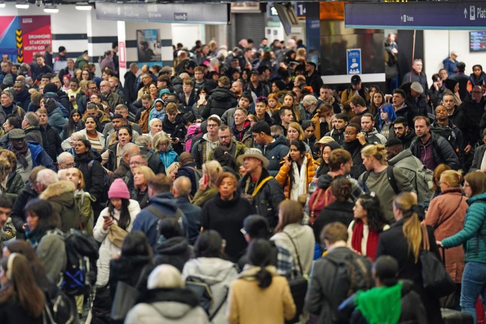 Passengers at Euston Station, London, on Thursday (James Manning/PA Wire)