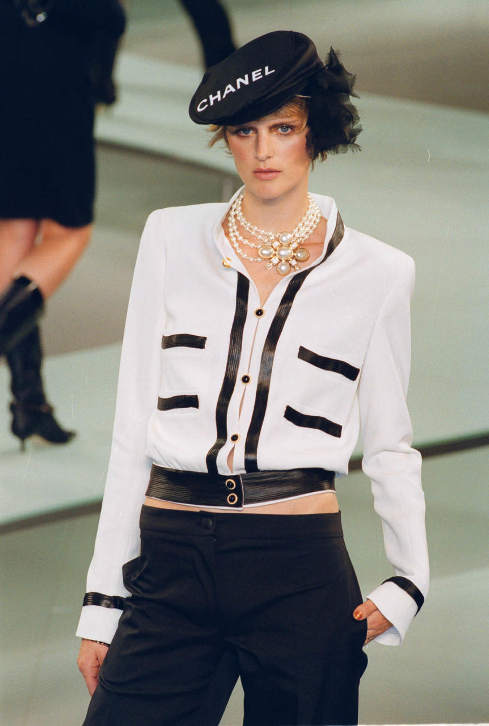 A model wears an outfit from Lagerfeld's spring/summer 2002 ready-to-wear fashion collection for Chanel, Oct. 10, 2001, in Paris.