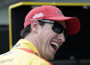 Joey Logano laughs in the garage during qualifying for the NASCAR Cup Series auto race at the Homestead-Miami Speedway, Saturday, Nov. 17, 2018, in Homestead, Fla. (AP Photo/Terry Renna)