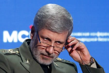 FILE PHOTO: Iranian Defence Minister Amir Hatami adjusts a headphone during the annual Moscow Conference on International Security in Moscow