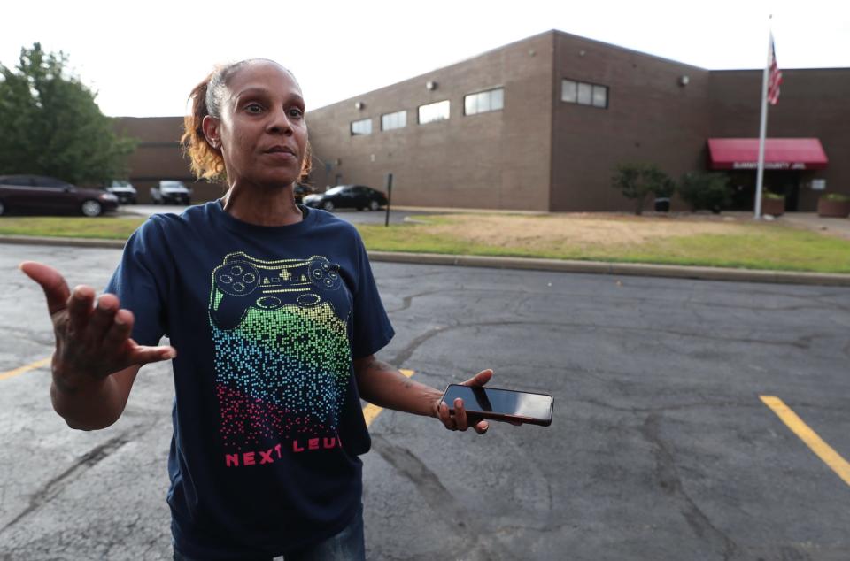 Jennifer Rodgers, who was looking to pick up her autistic son, Marquise Finley, Tuesday at the Summit County Jail, talks about her plight. Finley was arrested during a protest over the weekend.