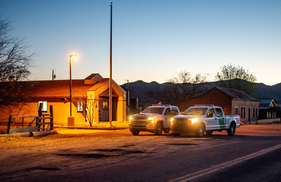 U.S. Border Patrol trucks sit parked on the main road in Arivaca on April 15. (Photo: Eli Imadali for HuffPost)