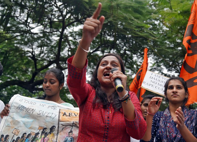 People shout slogans during a protest against the alleged rape and murder of a 27-year-old woman in Hyderabad