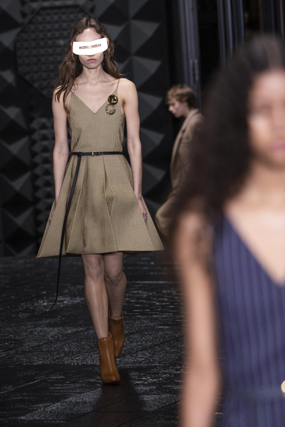 A model wears a creation for the Louis Vuitton Fall/Winter 2023-2024 ready-to-wear collection presented Monday, March 6, 2023 in Paris. (Vianney Le Caer/Invision/AP)