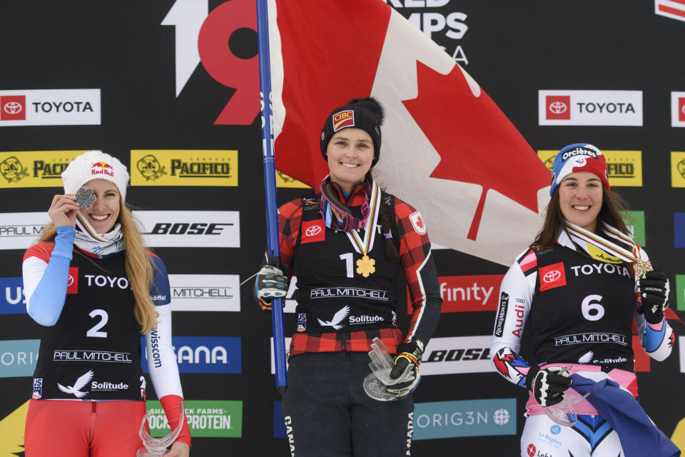 Silver medalist Fanny Smith, left, of Switzerland; gold medalist Marielle Thompson, center, of Canada; and bronze medalist Alizee Baron, of France, celebrate on the podium after the women's ski cross event at the freestyle ski and snowboard world championships Saturday, Feb. 2, 2019, in Solitude, Utah. (AP Photo/Alex Goodlett)