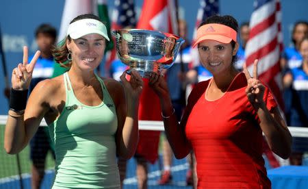 Sep 13, 2015; New York, NY, USA; Martina Hingis of Switzerland and Sania Mirza of India with the US Open Trophy after beating Casey Dellacqua of Australia and Yaroslava Shvedova of Kazakhstan in the Women's Doubles final on day fourteen of the 2015 U.S. Open tennis tournament at USTA Billie Jean King National Tennis Center. Robert Deutsch-USA TODAY Sports