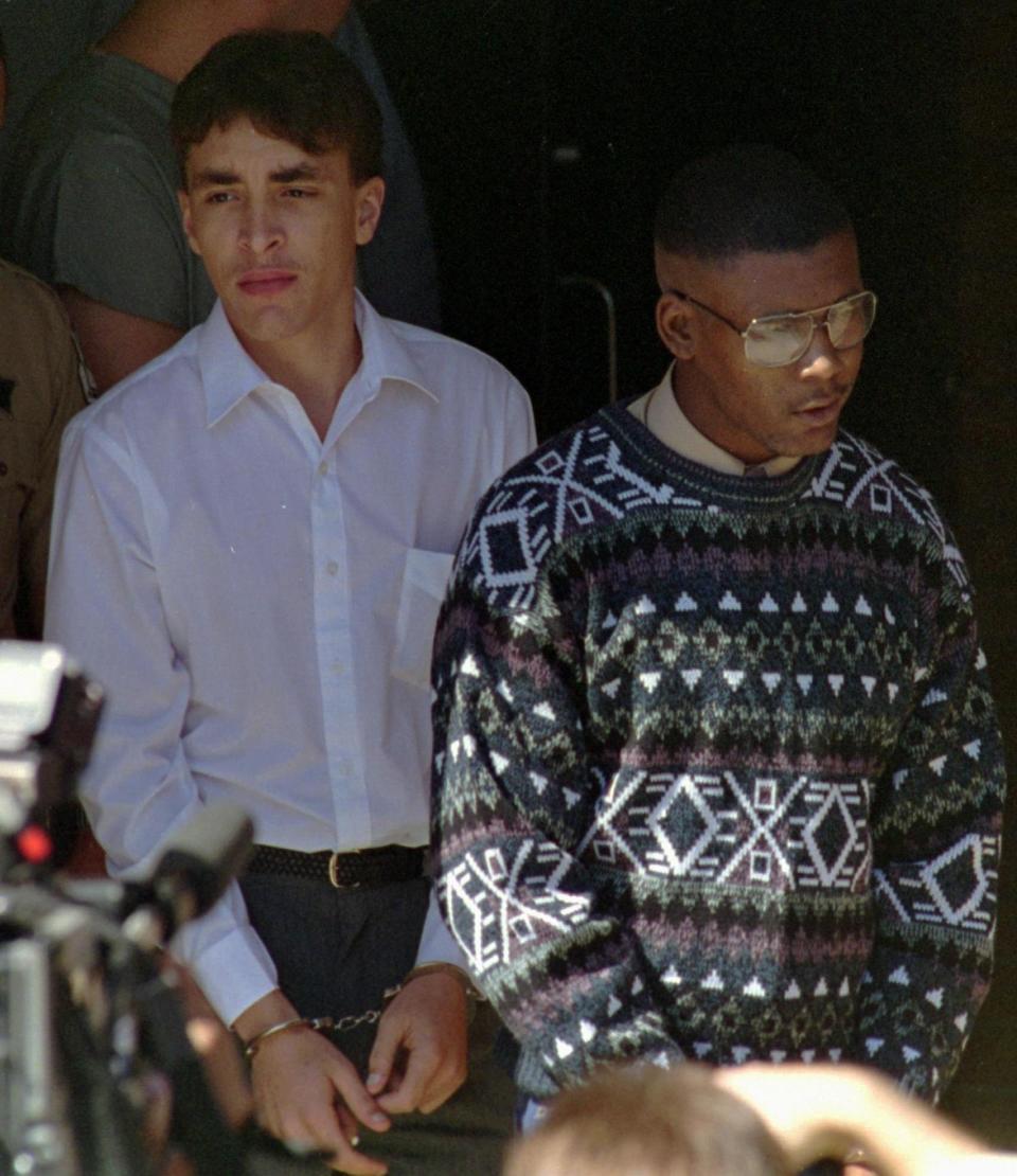 Larry Demery and Daniel Green leave a courthouse in Lumberton, North Carolina, on Tuesday, October 5, 1993. / Credit: Jim Bounds / AP