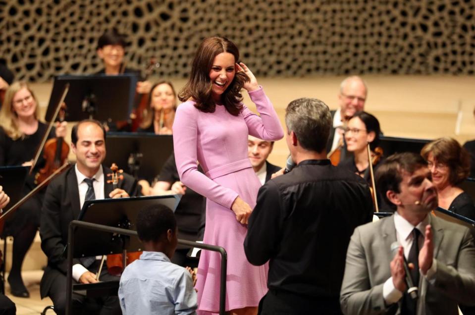 The Duchess tries her hand at conducting the orchestra (PA)