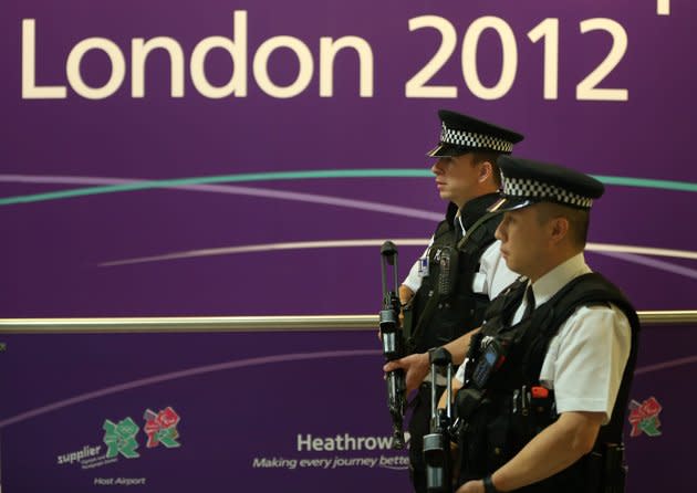 LONDON, ENGLAND - JULY 16: Armed poilice patrol Terminal 4 as Olympic athletes arrive at Heathrow Airport on July 16, 2012 in London, England. Athletes, coaches and Olympic officials are beginning to arrive in London ahead of the Olympics. (Photo by Peter Macdiarmid/Getty Images)