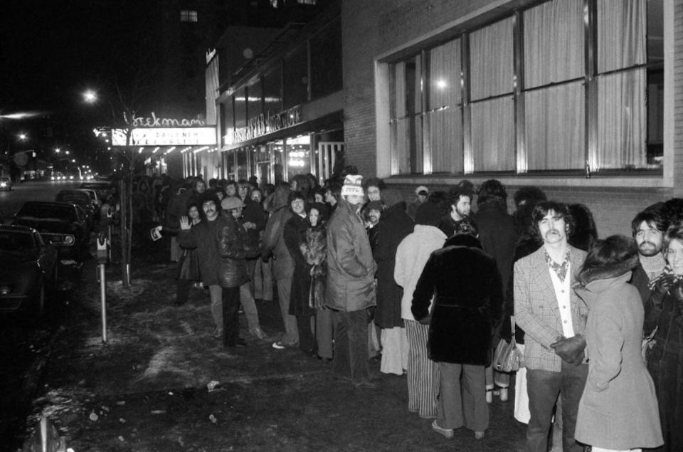 A crowd braves frigid weather in New York City to see ‘The Exorcist’ in February 1974. <a href="https://www.gettyimages.com/detail/news-photo/scene-from-dantes-inferno-it-might-be-with-stem-rising-from-news-photo/1160965641?adppopup=true" rel="nofollow noopener" target="_blank" data-ylk="slk:Bettmann Archive/Getty Images;elm:context_link;itc:0;sec:content-canvas" class="link ">Bettmann Archive/Getty Images</a>