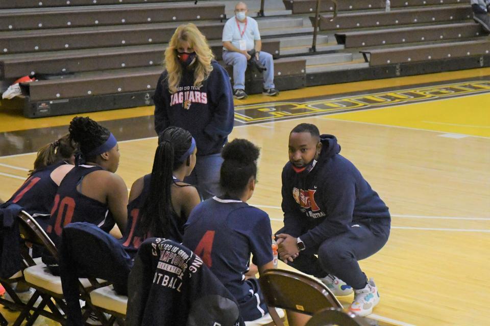 Medford Tech coach Demetrius Briggs talks through a play during a timeout against Kingsway