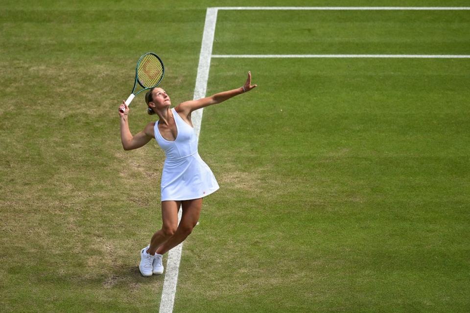 Marta Kostyuk of Ukraine wearing her bridal-inspired tennis dress on July 4, 2024 at Wimbledon.