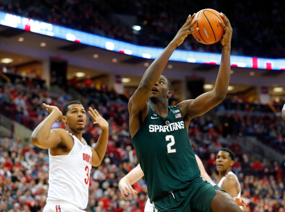 Michigan State forward Jaren Jackson Jr. (2) goes in as Ohio State forward Kaleb Wesson (34) defends during the second half of MSU's 80-64 loss on Sunday, Jan. 7, 2018, in Columbus, Ohio.
