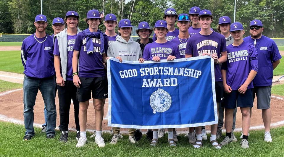 Head coach Eric Wells, far left, and the Marshwood High School baseball team received their 2023 Good Sportsmanship banner prior to June's Class A state championship game between South Portland and Edward Little at the University of Southern Maine.