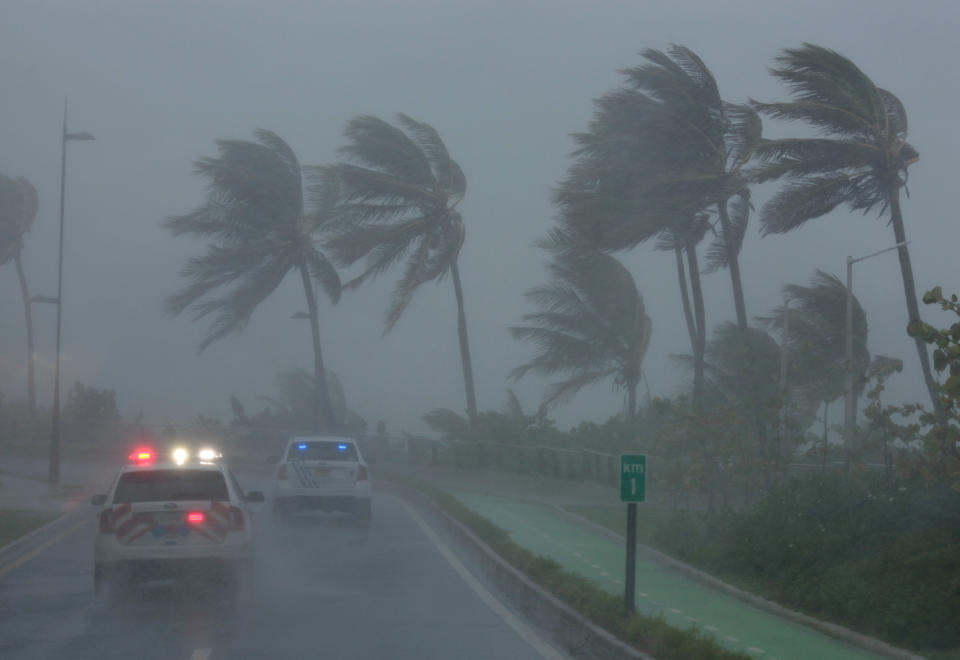 <p>Police patrol the area as Hurricane Irma slams across islands in the northern Caribbean on Wednesday, in San Juan, Puerto Rico, Sept. 6, 2017. (Photo: Alvin Baez/Reuters) </p>