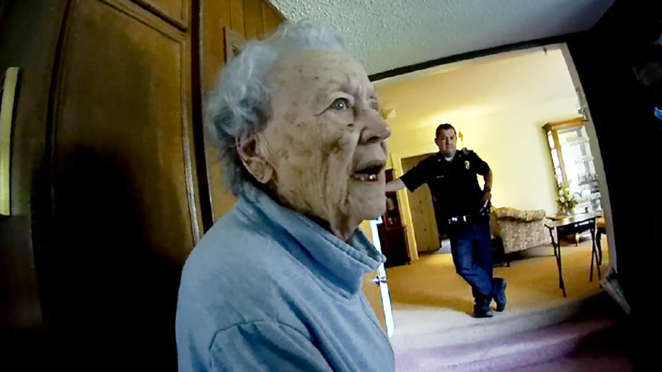 Joan Meyer, the 98-year-old co-owner of the Marion County Record, was defiant as police Chief Gideon Cody, seen the background, and other officers raided her home