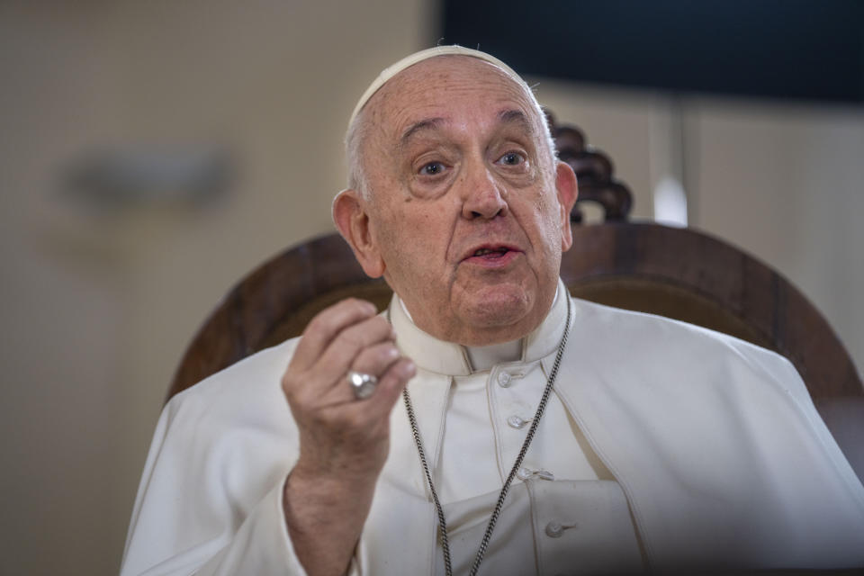 Pope Francis speaks during an interview with The Associated Press at The Vatican, Tuesday, Jan. 24, 2023. Pope Francis said he hasn't even considered issuing norms to regulate future papal resignations and says he plans to continue on for as long as he can as bishop of Rome, despite a wave of attacks against him by some top-ranked cardinals and bishops. (AP Photo/Domenico Stinellis)