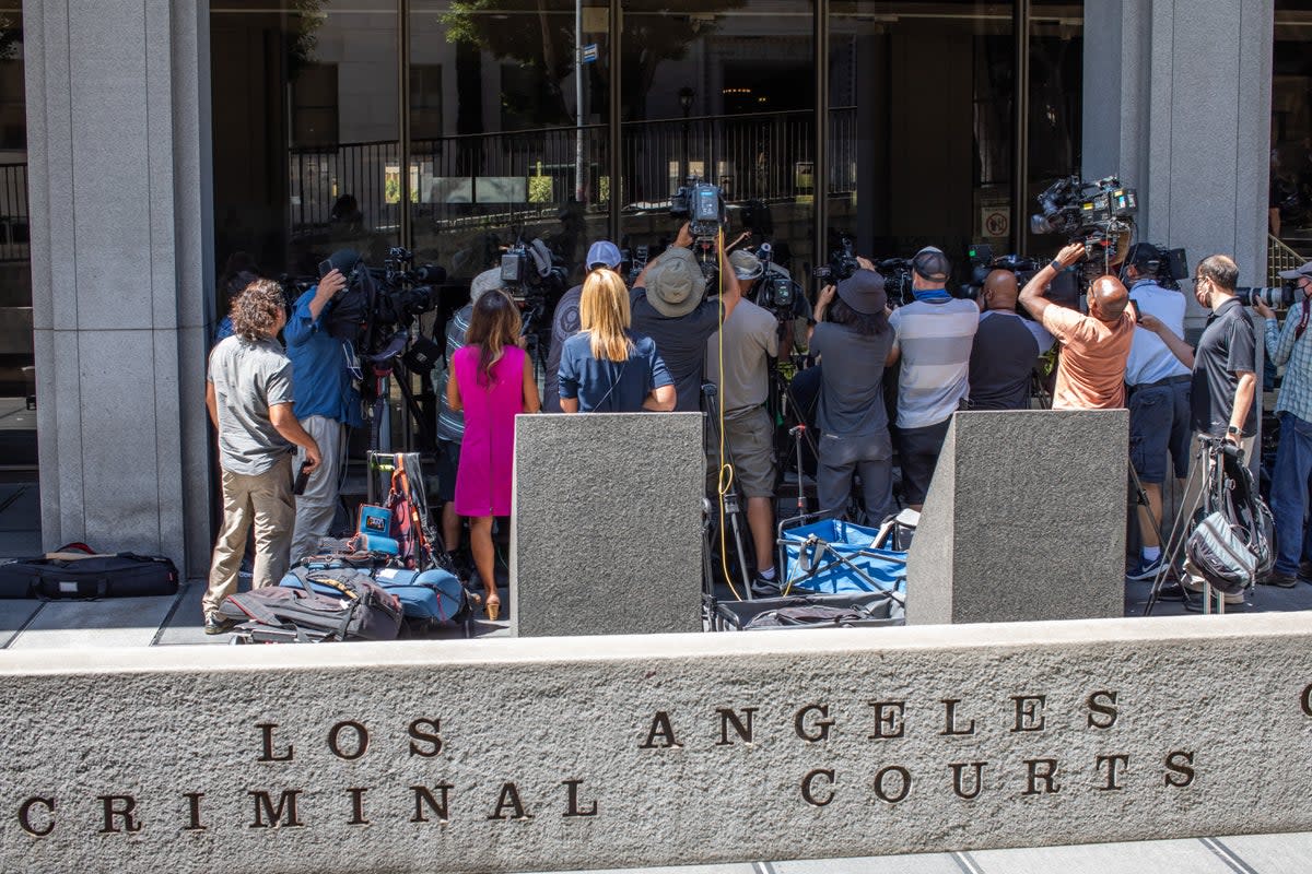 Journalists gather around attorney Gloria Allred at the Clara Shortridge Foltz Criminal Justice Center during the arraignment of former Hollywood producer Harvey Weinstein on 21 July 2021 in Los Angeles, California (Apu Gomes/Getty Images)