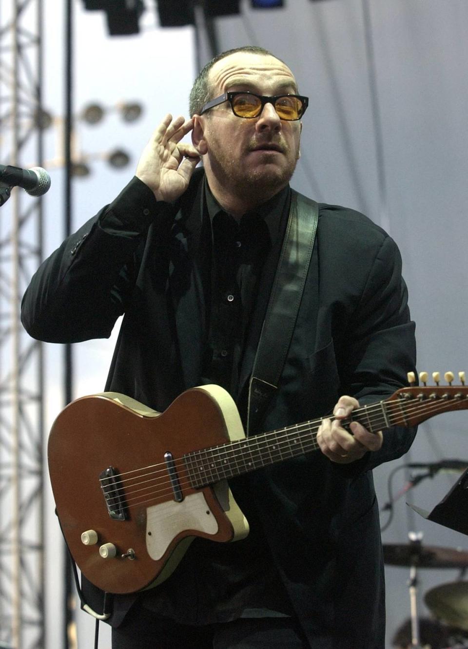Elvis Costello waits for audience response during a song performance at Mountain Aire concert in May 2002 in Angels Camp.