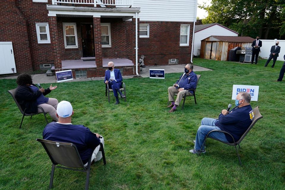 Democratic presidential candidate former Vice President Joe Biden listens during a campaign event with steelworkers in the backyard of a home in Detroit, on Sept. 9, 2020.