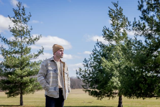 William Littig poses for a portrait at Busse Woods in the northwest suburbs of Chicago on March 27. Littig spent four and a half years with the outdoor retailer REI before he was fired in February. 