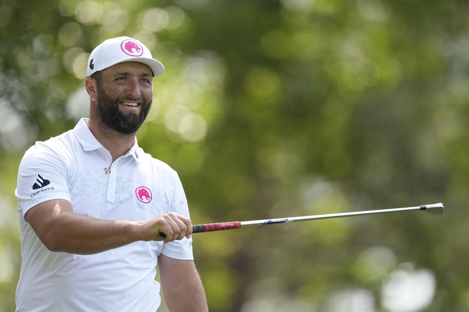 Jon Rahm, of Spain, watches his tee shot on the fourth hole during a practice round in preparation for the Masters golf tournament at Augusta National Golf Club Wednesday, April 10, 2024, in Augusta, GA. (AP Photo/George Walker IV)