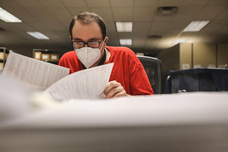 Tracing center staff work in shifts around the clock to both organize documents and be ready to search through records if a trace is requested by law enforcement. (Peter Kavanagh / NBC News)