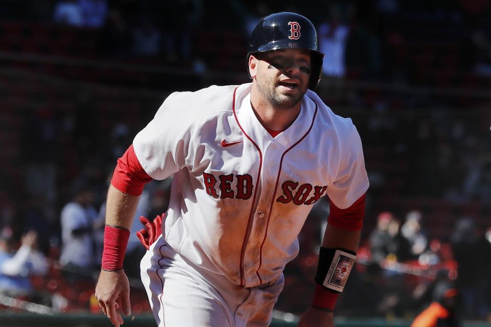 Boston Red Sox's Kevin Plawecki reacts after scoring on a single by J.D. Martinez during the fifth inning of a baseball game against the Baltimore Orioles, Saturday, April 3, 2021, in Boston. (AP Photo/Michael Dwyer)