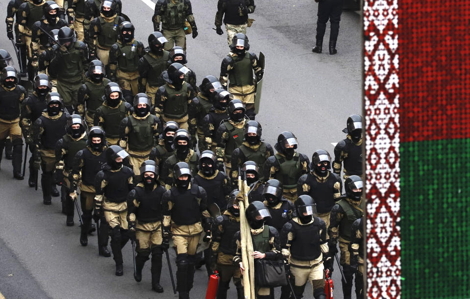 Belarusian police block a street during an opposition rally to protest the official presidential election results in Minsk, Belarus, Sunday, Oct. 25, 2020. The demonstrations were triggered by official results giving President Alexander Lukashenko 80% of the vote in an Aug. 9 election that the opposition insists was rigged. Lukashenko, who has ruled Belarus with an iron fist since 1994, has accused the United States and its allies of fomenting unrest in the ex-Soviet country. (AP Photo)