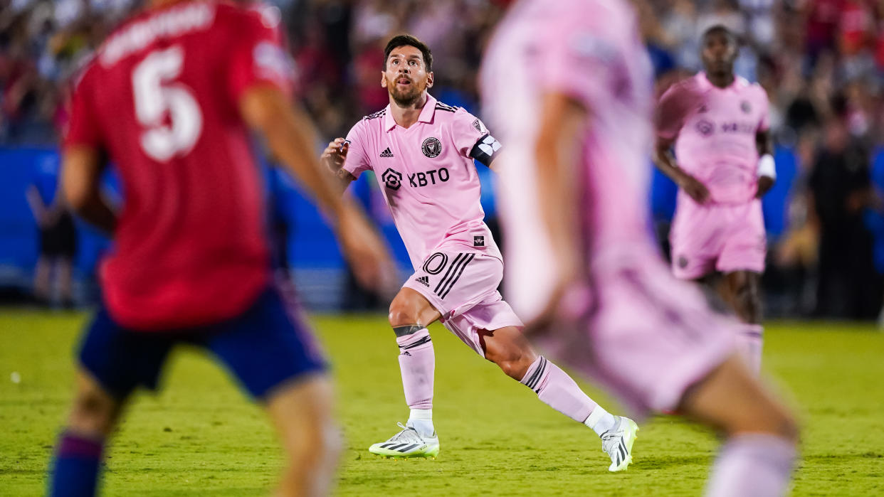  Inter Miami player Lionel Messi mid-stride in the iconic baby pink kit. 