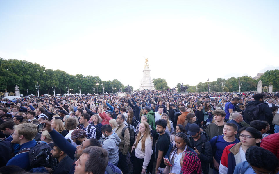 Members of the public gather Buckingham Palace in central London following the announcement of the death of Queen Elizabeth II. Picture date: Thursday September 8, 2022. (Photo by Yui Mok/PA Images via Getty Images)