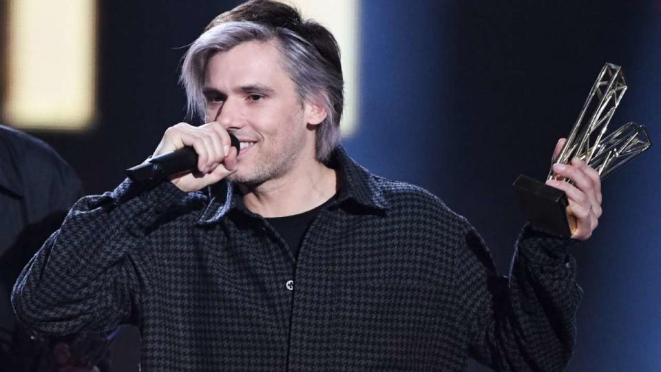 French singer, composer and actor Aurelien Cotentin aka Orelsan reacts after receiving the Best Original Song award for 