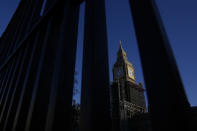 FILE - Britain's Parliament buildings and Big Ben are seen through railings in Westminster in London, Jan. 13, 2022. Some Conservative lawmakers in Britain are talking about ousting their leader, Prime Minister Boris Johnson, over allegations that he and his staff held lockdown-breaching parties during the coronavirus pandemic. The party has a complex process for changing leaders that starts by lawmakers writing letters to demand a no-confidence vote. (AP Photo/Kirsty Wigglesworth, File)