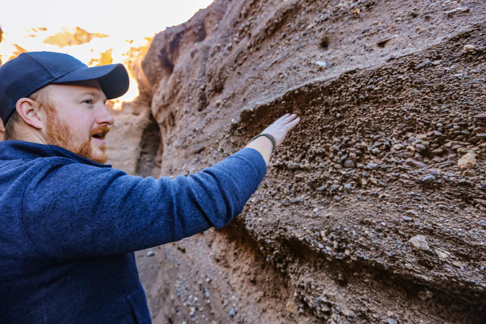 Patrick Nolan, who leads Friends of Organ Mountains-Desert Peaks, shows off Slot Canyon in the Robledo Mountains near Radium Springs on Thursday, Dec. 12, 2019.