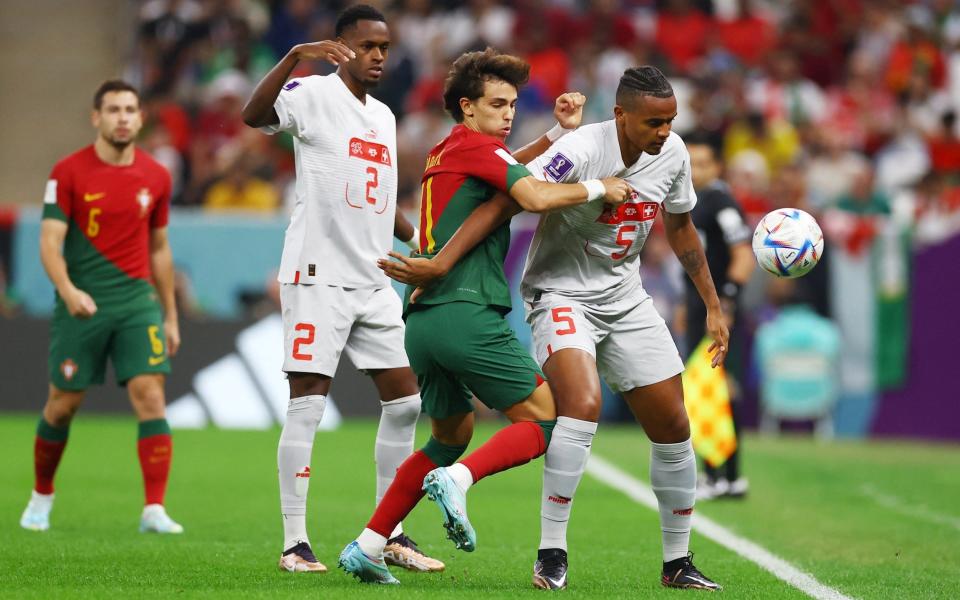 Switzerland's Manuel Akanji in action with Portugal's Joao Felix - REUTERS