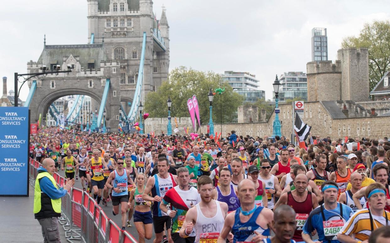 Runner cross Tower Bridge in last year's London Marathon - Paul Grover