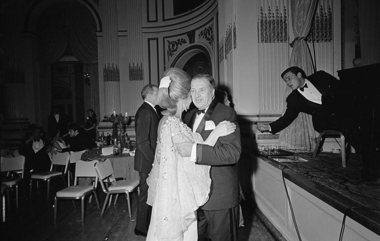 Ford Motor Company CEO Henry Ford II and his wife Anne McDonnell dance at the Black and White Ball.<span class="copyright">Harry Benson—Daily Express/Hulton Archive/Getty Images</span>