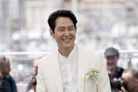 Lee Jung-jae poses for photographers at the photo call for the film 'Hunt' at the 75th international film festival, Cannes, southern France, Thursday, May 19, 2022. (Photo by Joel C Ryan/Invision/AP)