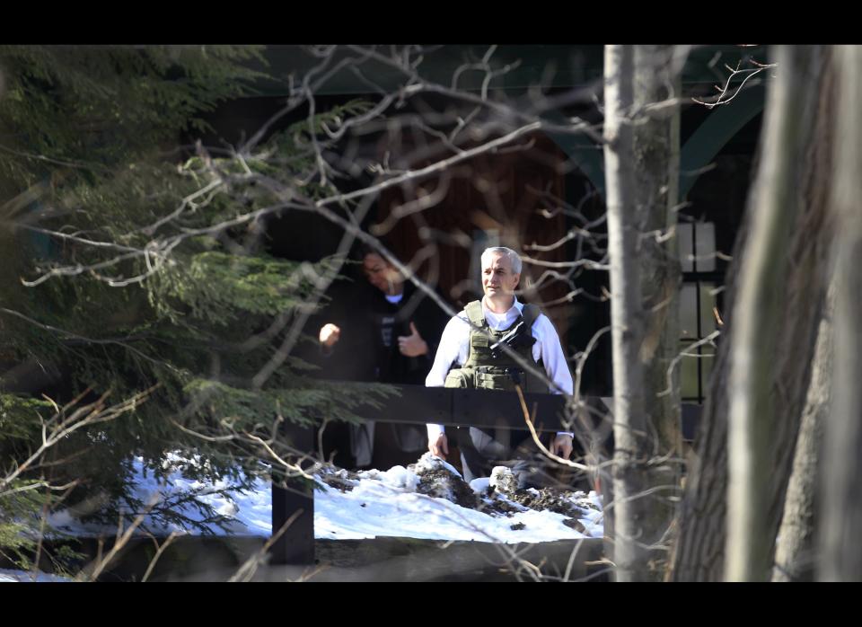 Investigative agents search a home several miles from the shooting Monday, Feb. 27, 2012, in Chardon, Ohio. A gunman opened fire inside a high school cafeteria at the start of the school day Monday, immediately killing three students and wounding two others, authorities said. A suspect believed to be a student was arrested a short distance away. (AP Photo/Tony Dejak)