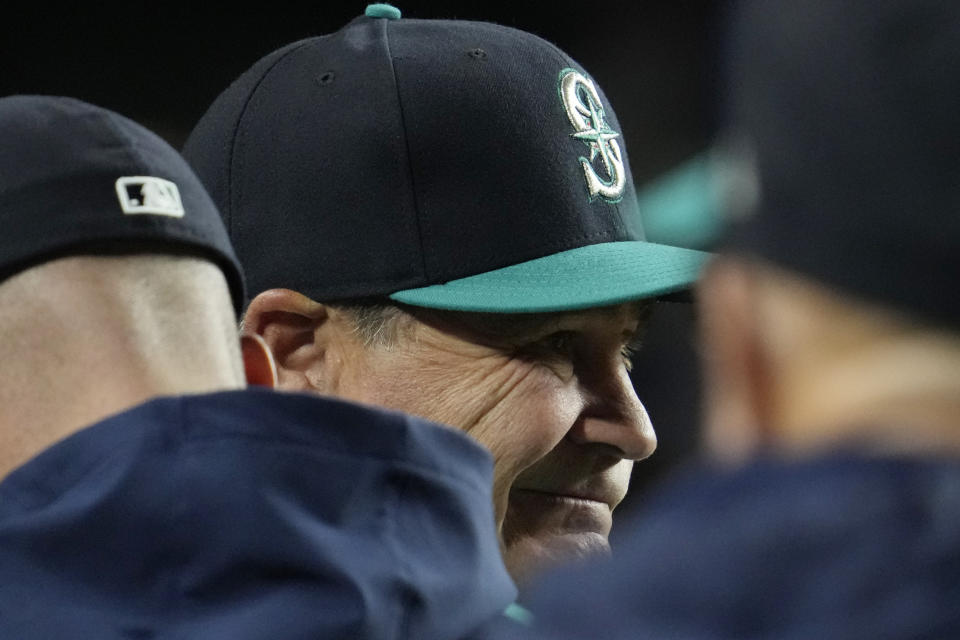 Seattle Mariners manager Scott Servais reacts as he watches players during the eighth inning of a baseball game against the Chicago Cubs in Chicago, Tuesday, April 11, 2023. The Cubs won 14-9. (AP Photo/Nam Y. Huh)