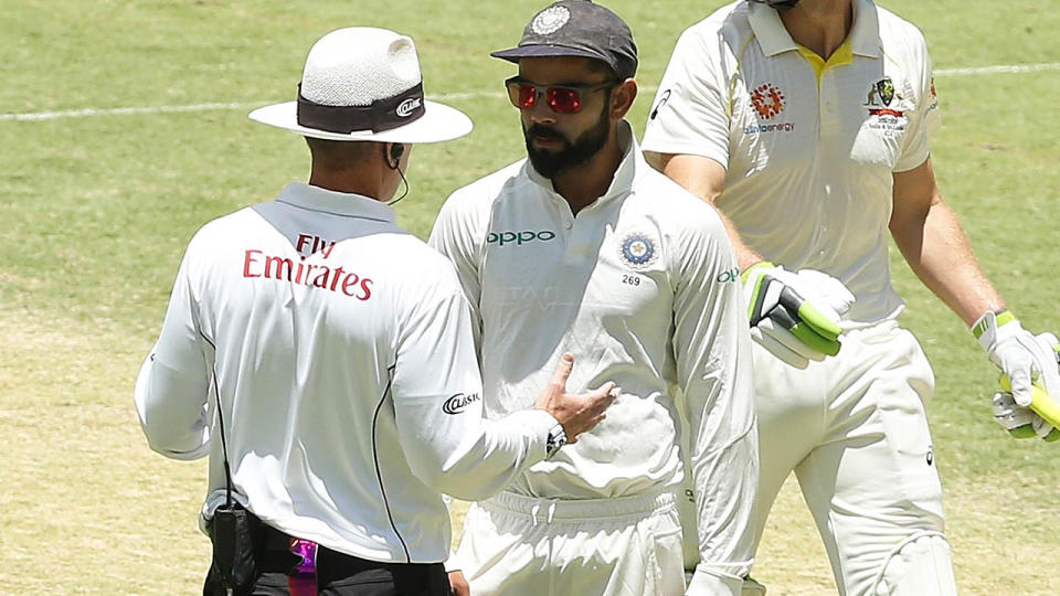 Umpire Chris Gaffaney talks with Virat Kohli. (Photo by Paul Kane – CA/Cricket Australia/Getty Images)