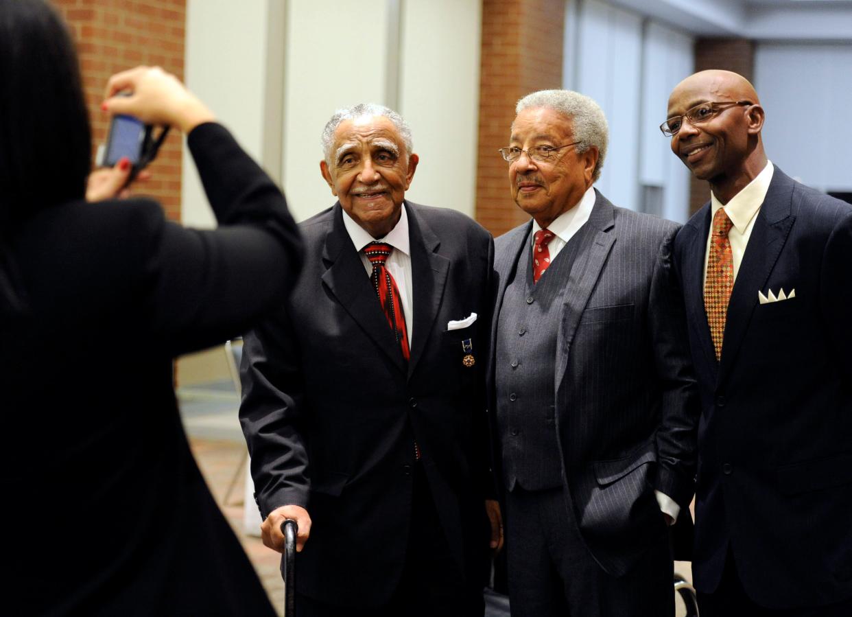 Erika Taylor, far left, takes a picture of keynote speaker, Rev. Dr. Joseph E. Lowery, left, with Dr. Ira Neal, center, and Jerome Stewart, right, before the Diversity Awards at The Centre in Evansville on Thursday, September 29, 2011. Lowery, a national civil rights activist, delivered the benediction at the inauguration of Barack Obama as the 44th President of the United States of America in 2009.