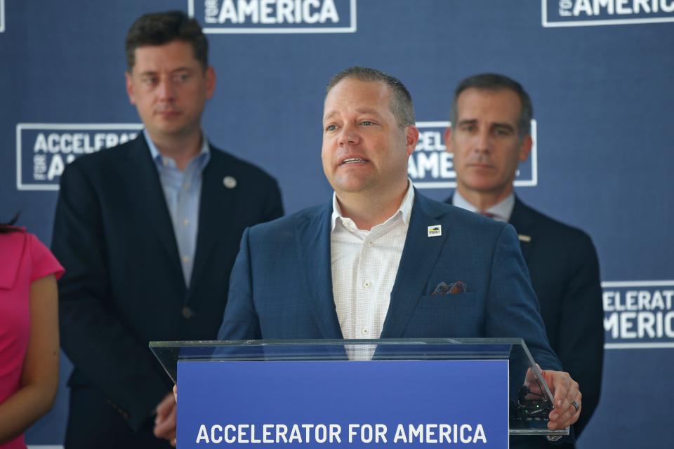 Rochester Hills, Mich. Mayor Bryan Barnett, center, speaks as Oklahoma City Mayor David Holt, left, and Los Angeles Mayor Eric Garcetti, right, look on, during a news conference Friday, Sept. 6, 2019, following an Accelerator for America meeting in Oklahoma City. (AP Photo/Sue Ogrocki)