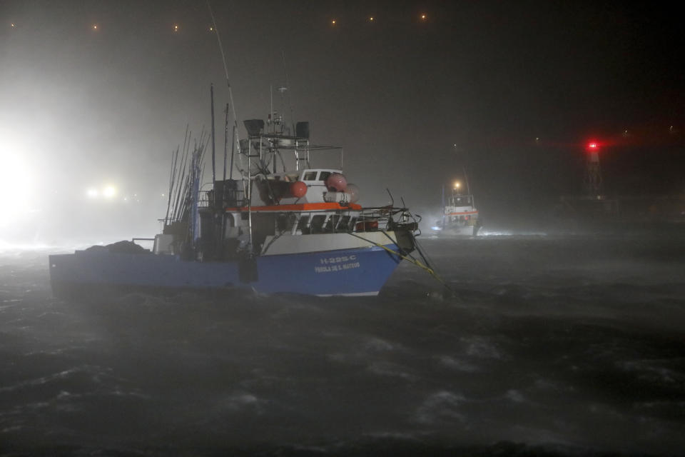 Fishing boats rock under heavy rain and strong winds at the port in Horta, in the Portuguese island of Faial, Wednesday, Oct. 2, 2019. Hurricane Lorenzo is lashing the mid-Atlantic Azores Islands with heavy rain, powerful winds and high waves. The Category 2 hurricane passed the Portuguese island chain Wednesday. (AP Photo/Joao Henriques)