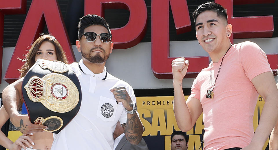 Abner Mares (L) and Leo Santa Cruz will meet in the ring Saturday in a rematch for the WBA featherweight title. (Getty Images)