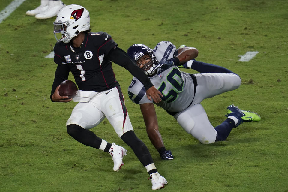 Arizona Cardinals quarterback Kyler Murray (1) breaks the tackle of Seattle Seahawks outside linebacker K.J. Wright (50) for a touchdown during the second half of an NFL football game, Sunday, Oct. 25, 2020, in Glendale, Ariz. (AP Photo/Ross D. Franklin)