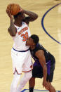 New York Knicks' Julius Randle (30) is guarded by Toronto Raptors' Kyle Lowry, right, during an NBA basketball game at Madison Square Garden, Sunday, April 11, 2021, in New York. (Rich Schultz/Pool Photo via AP)