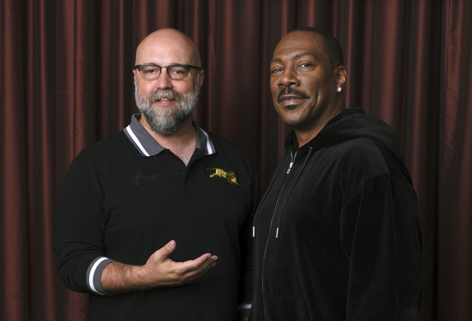 This Sept. 7, 2019 photo shows Eddie Murphy, right, star of the film "Dolemite Is My Name," with director Craig Brewer at the Shangri-La Hotel during the Toronto International Film Festival in Toronto. (Photo by Chris Pizzello/Invision/AP)